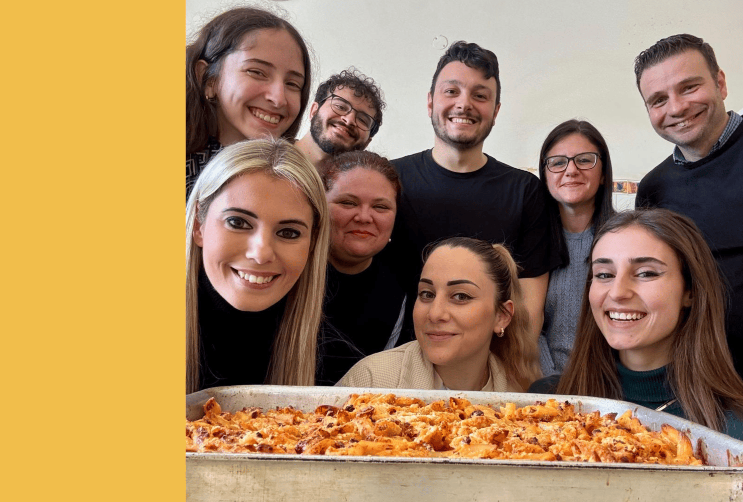 team of colleague in front of baked pasta